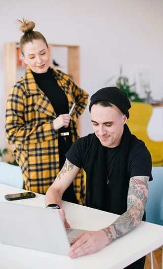 Origin8 team members reviewing work together
